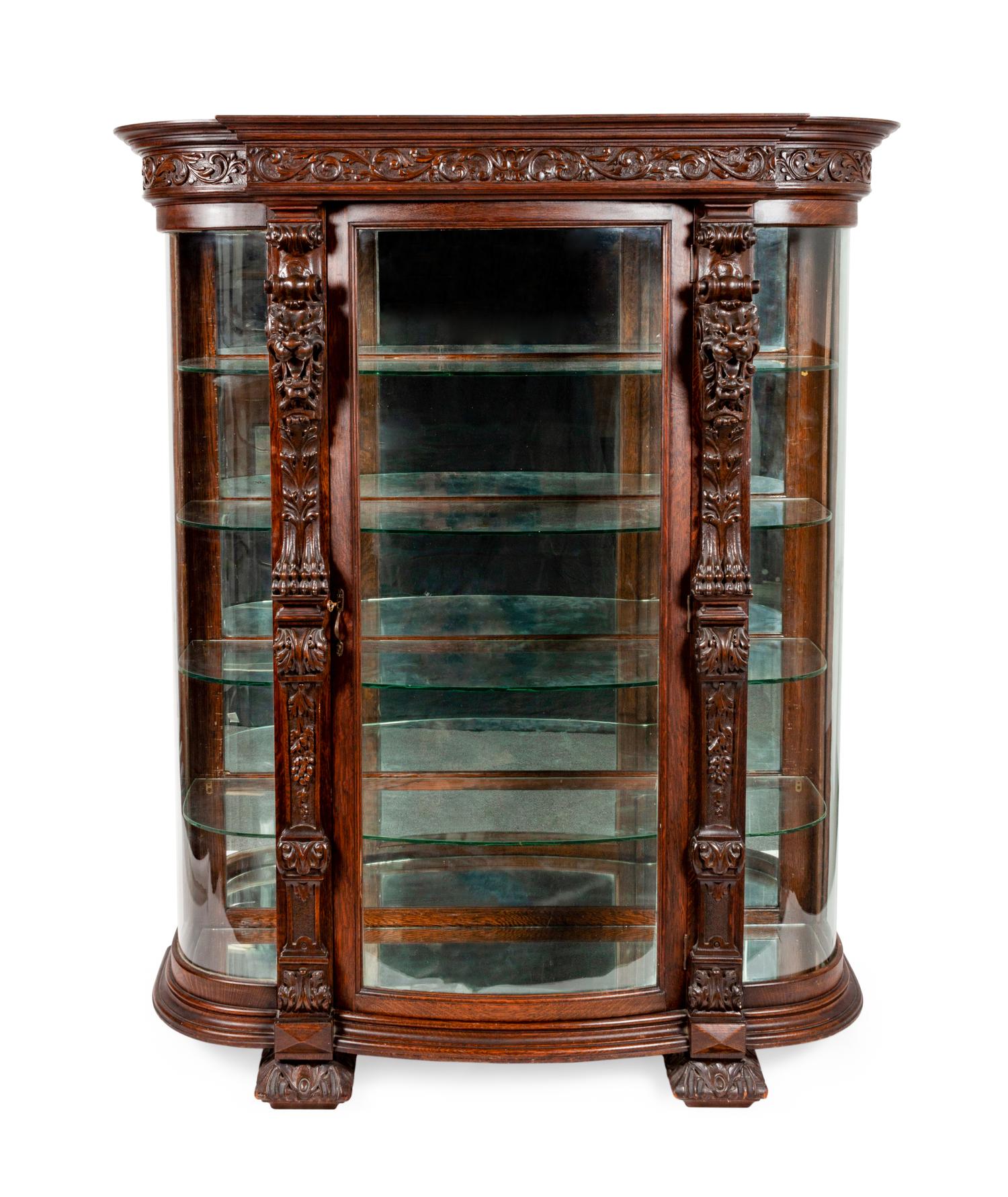 A Renaissance Revival Carved Oak Vitrine
