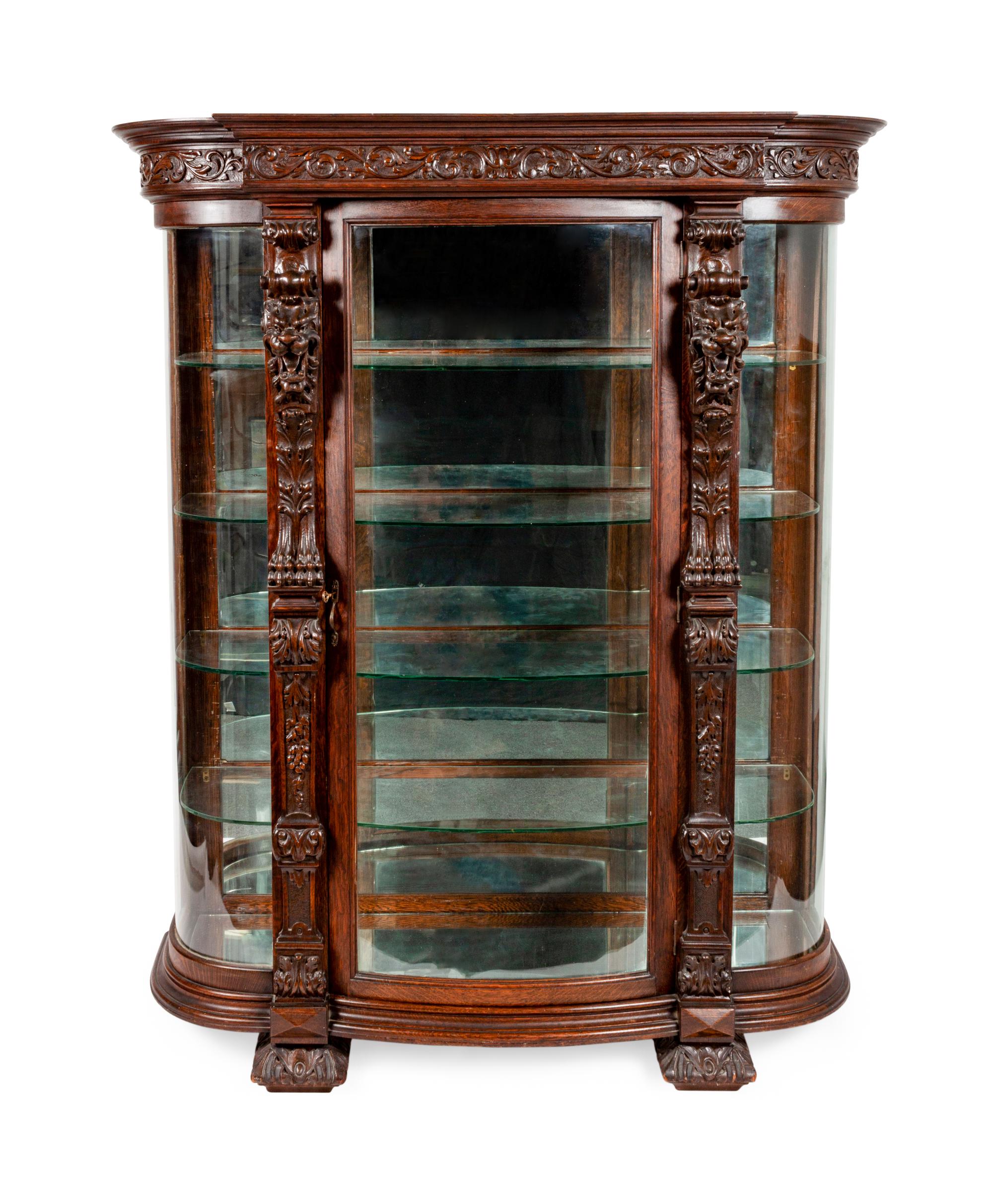 A Renaissance Revival Carved Oak Vitrine