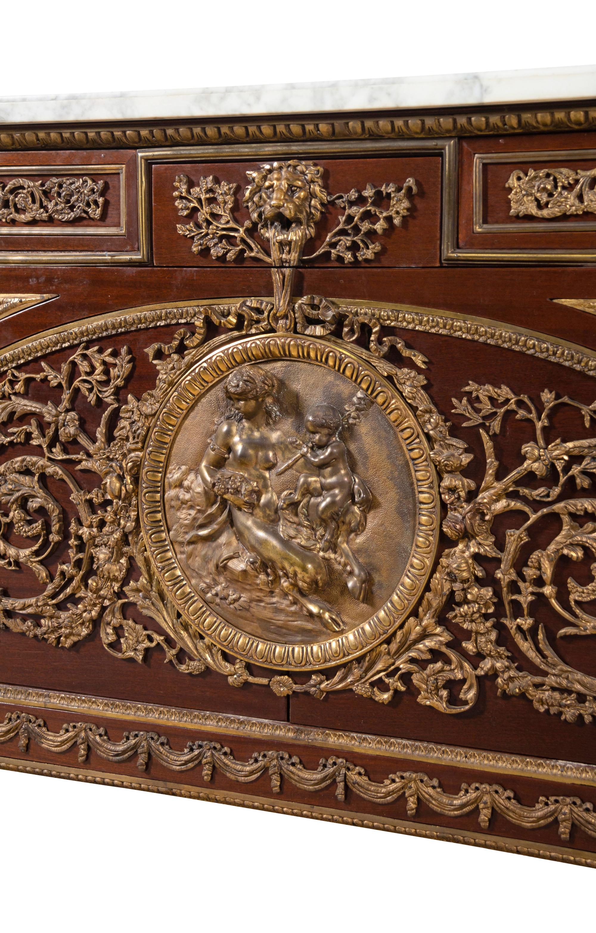 A Louis XVI Style Gilt Bronze Mounted Mahogany Marble-Top Commode à Vantaux After the Model by Guillaume Benneman