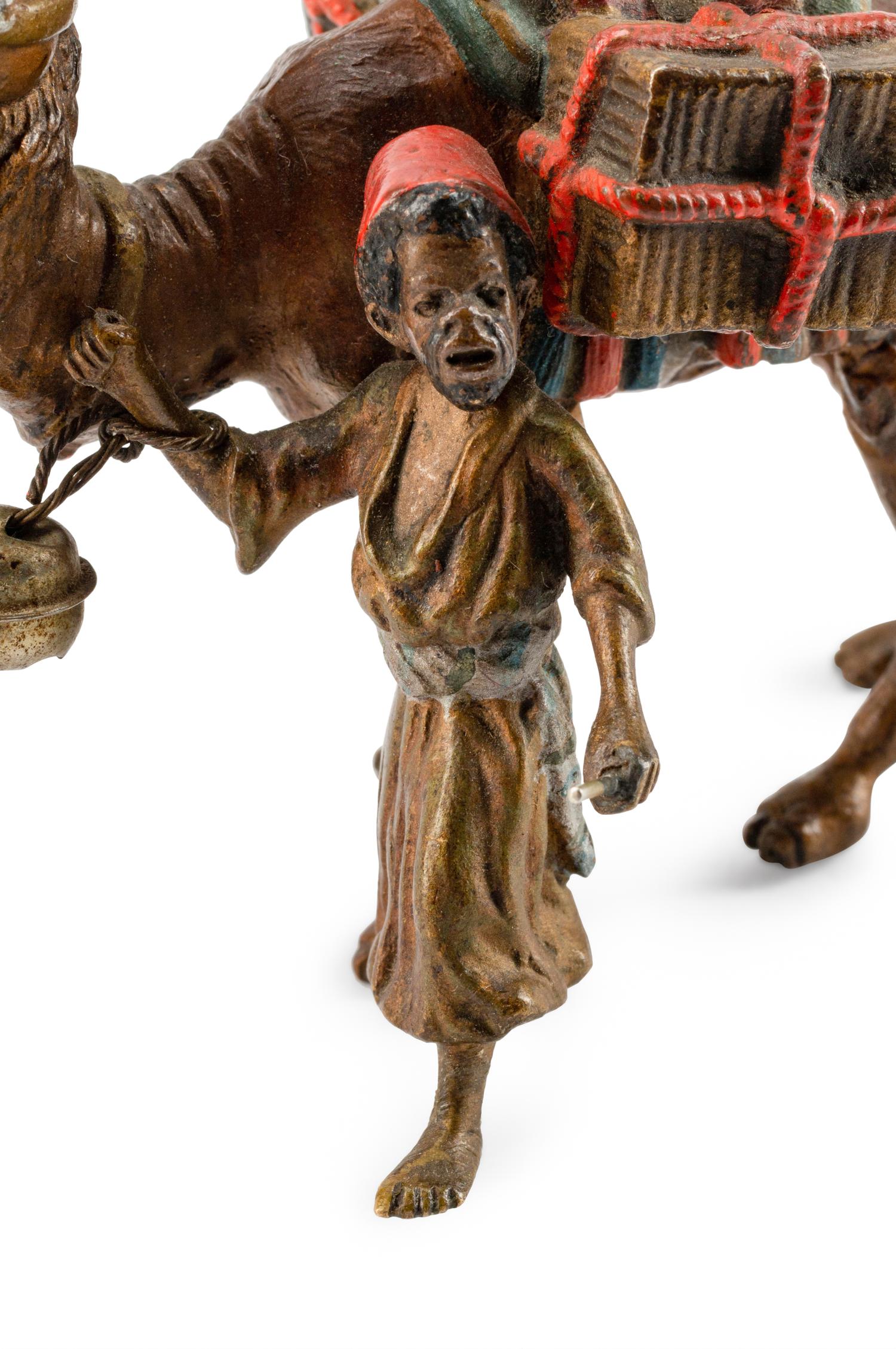 An Austrian Cold-Painted Bronze of a Boy With a Camel — CIRCA 1900