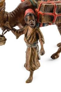 An Austrian Cold-Painted Bronze of a Boy With a Camel — CIRCA 1900