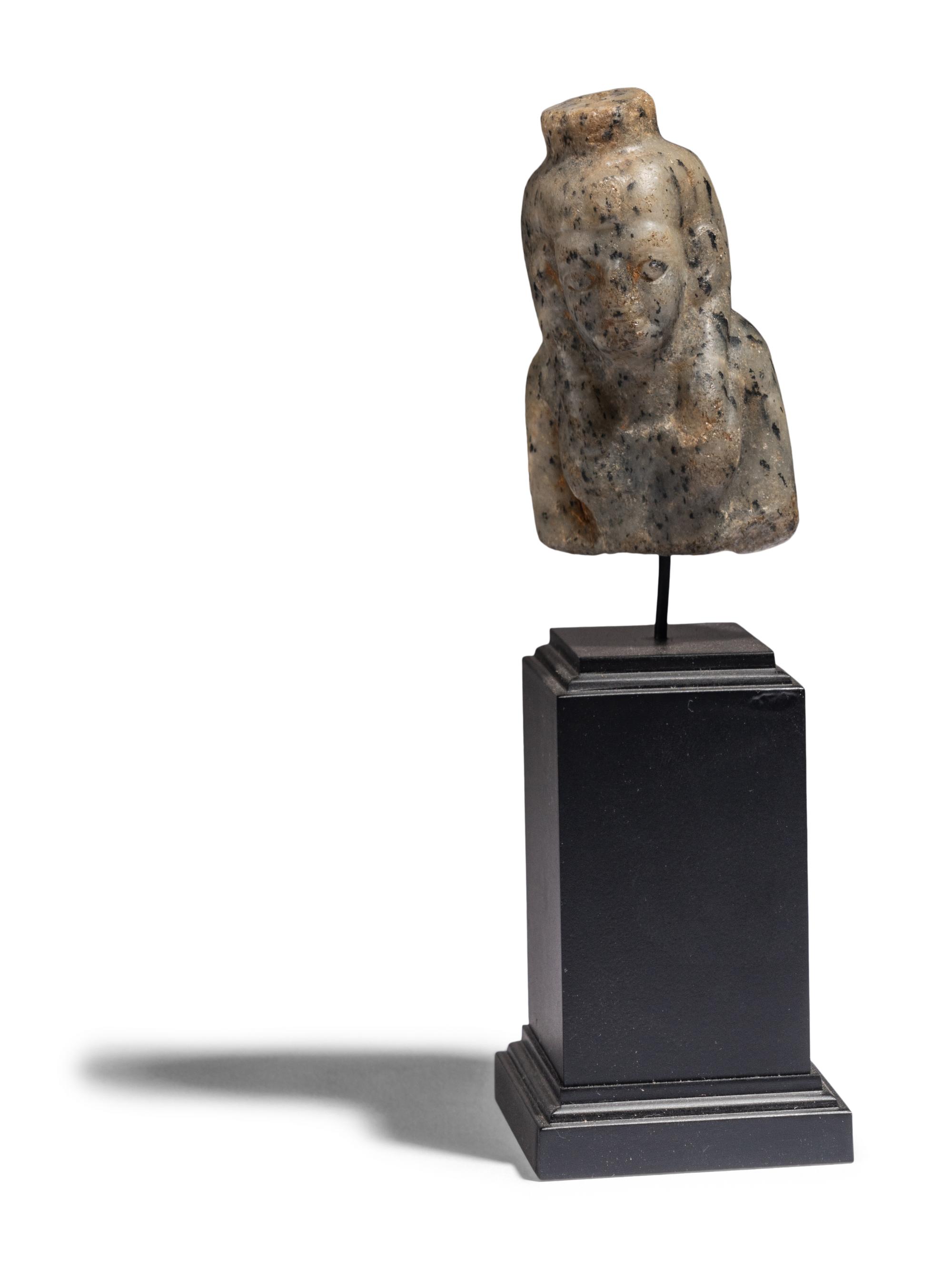 An Egyptian Stone Bust of Hathor