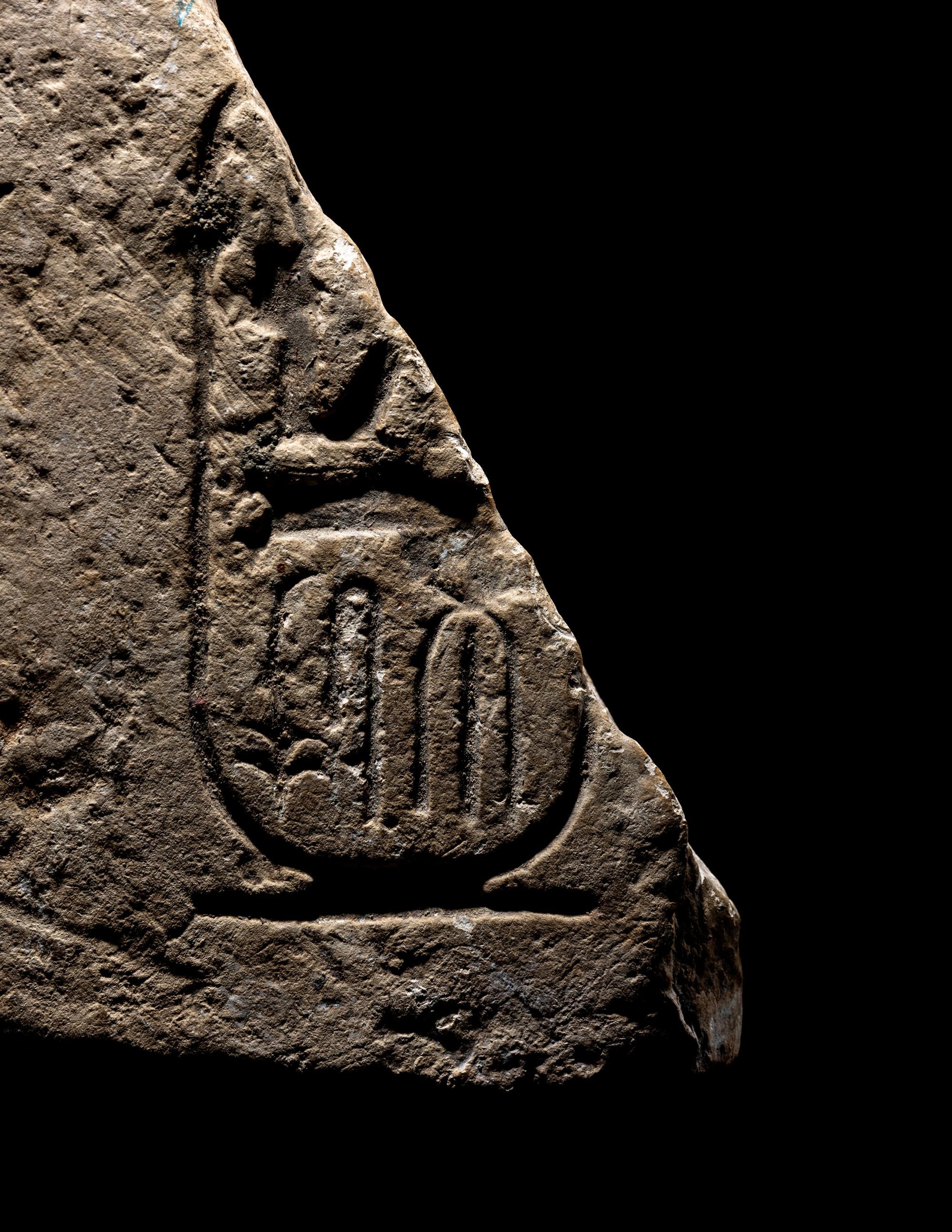 An Egyptian Limestone Relief Fragment with Cartouche of Ramesses II