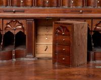A Chippendale Figured and Carved Walnut Desk-and-Bookcase