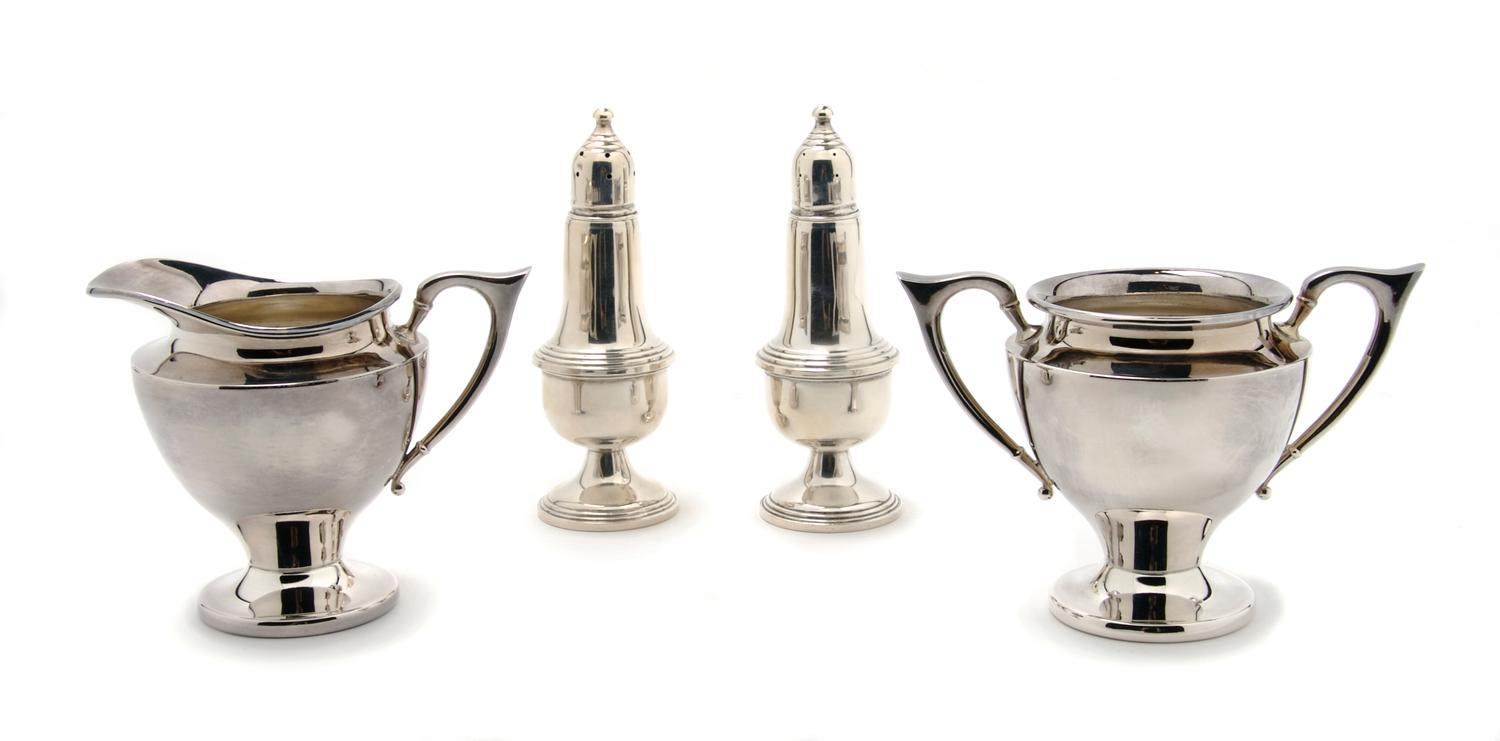A Group of Two American Sterling Silver Casters, Empire, Height of pair 5 1/8 inches.