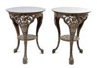 A Pair of Victorian Style Cast Iron Cafe Tables, Height 27 1/4 x diameter 21 inches.