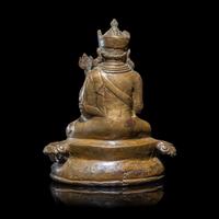 A Tibetan Copper Alloy Seated Figure of Padmasambhava, 16th/17th Century 十六/十七世紀 西藏銅合金銅蓮花生坐像