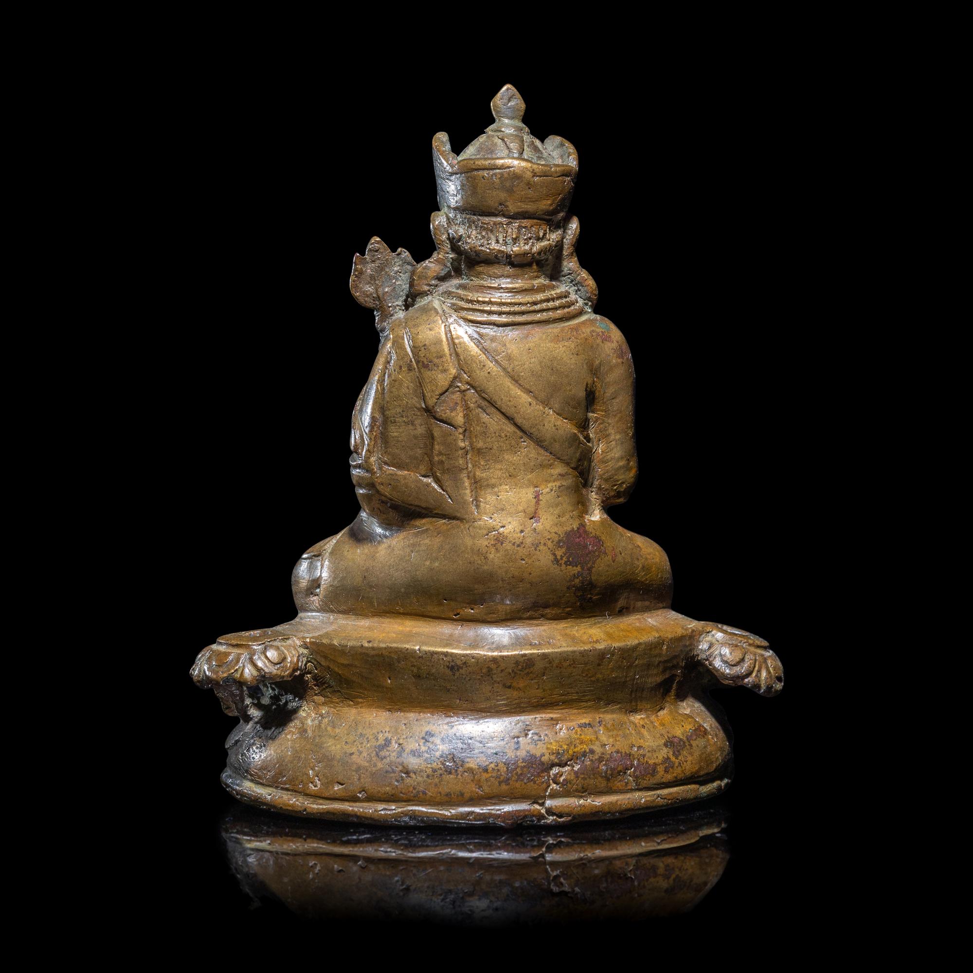 A Tibetan Copper Alloy Seated Figure of Padmasambhava, 16th/17th Century 十六/十七世紀 西藏銅合金銅蓮花生坐像