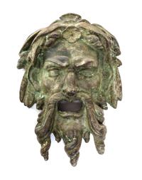 A Neoclassical Patinated Cast Stone Mask Height 16 inches. — 19TH/20TH CENTURY