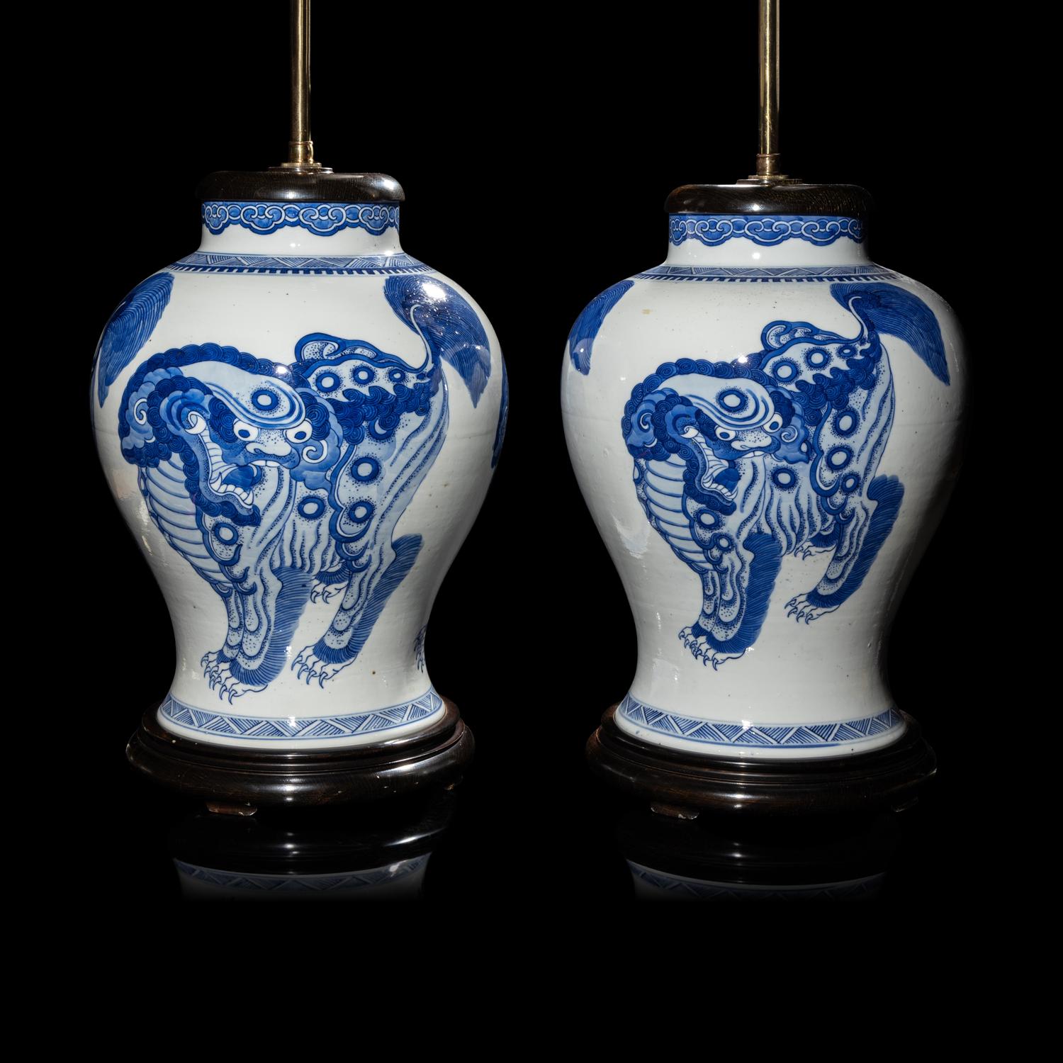 A Pair of Chinese Blue and White 'Buddhist Lion' Porcelain Jars, Kangxi Period or Later 清康熙或更晚 青花佛獅紋罐一對