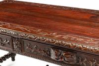 A French Renaissance Revival Carved Oak Library Table