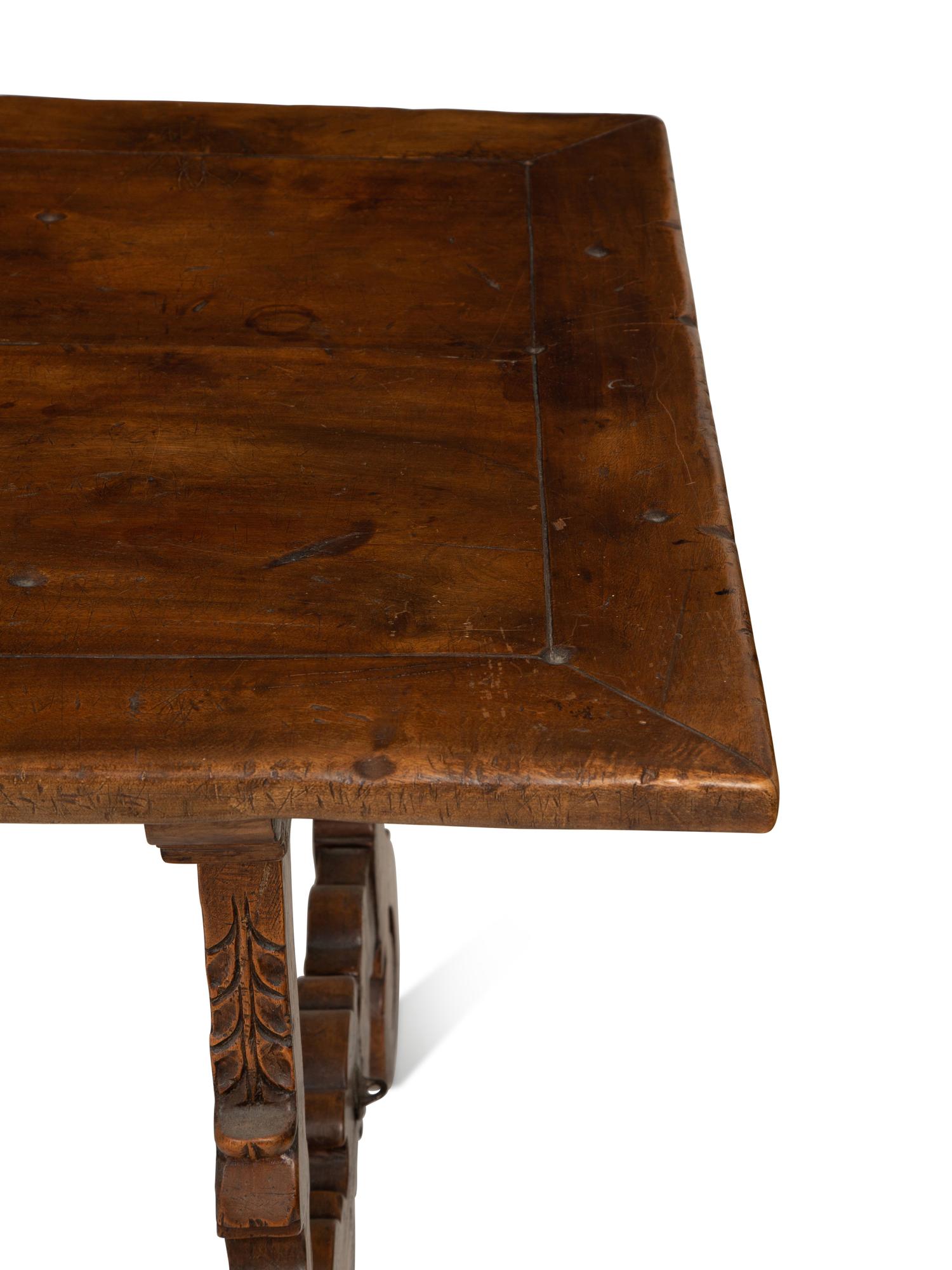 A Spanish Walnut and Wrought Iron Trestle Table