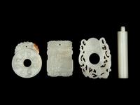 Four Chinese Carved Celadon Jade Pendants