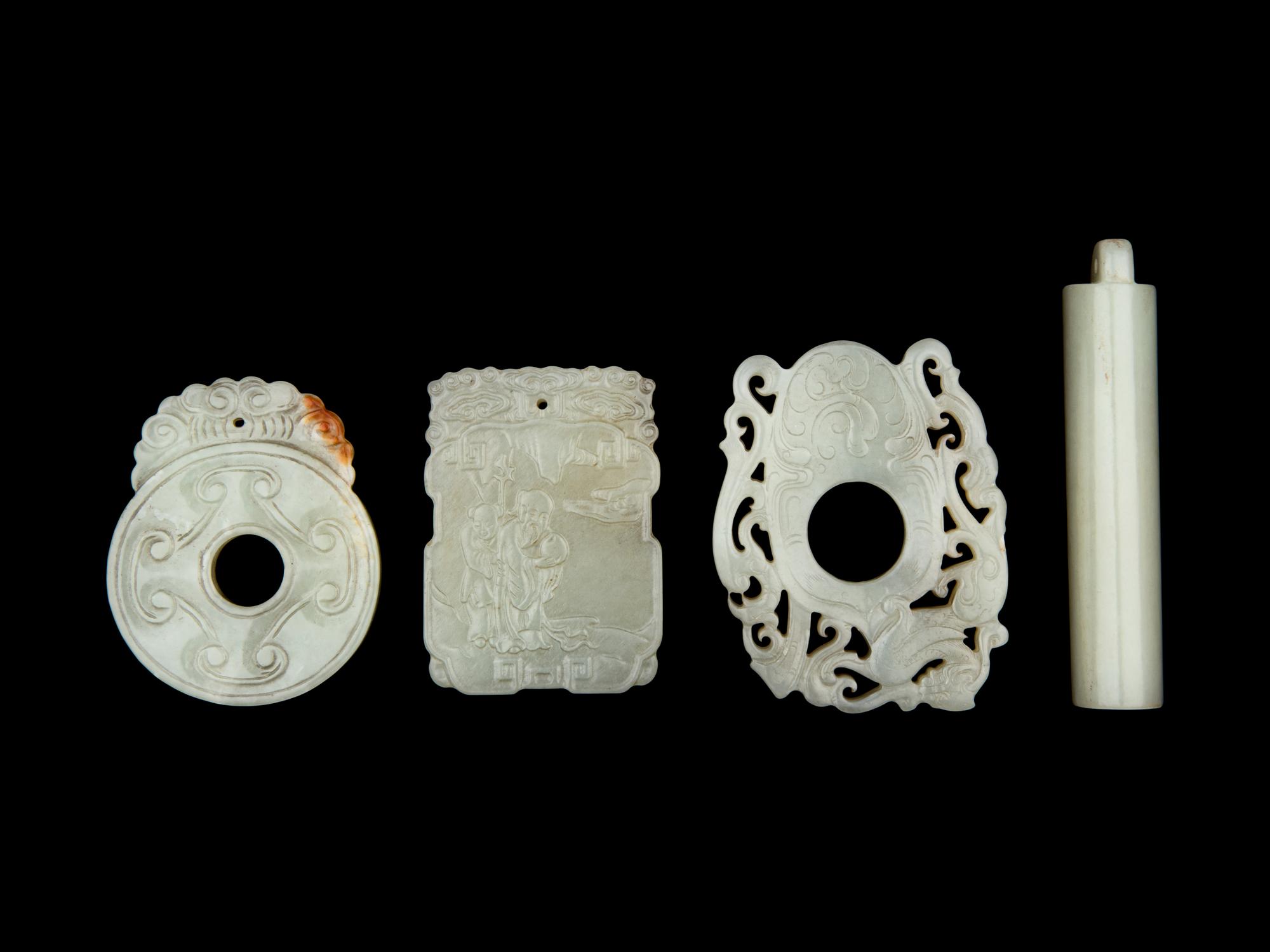 Four Chinese Carved Celadon Jade Pendants