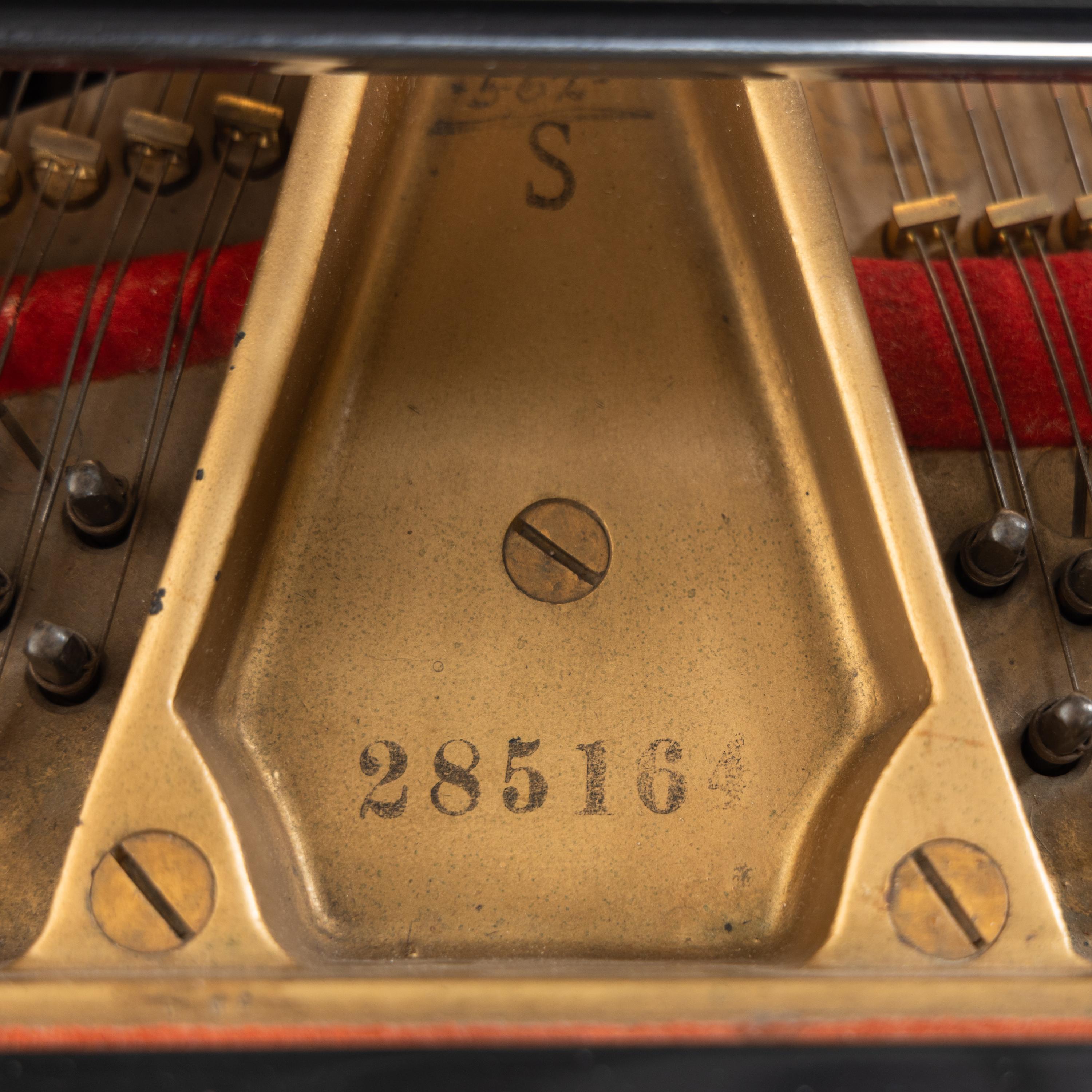 A Steinway and Sons Baby Grand Piano