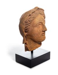 An Etruscan Terra Cotta Votive Head of a Woman