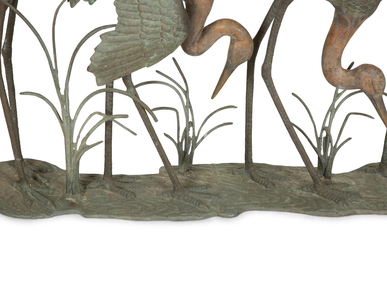 A Bronze Sculpture of Four Standing Cranes