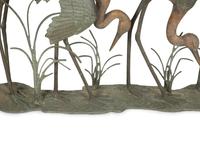 A Bronze Sculpture of Four Standing Cranes