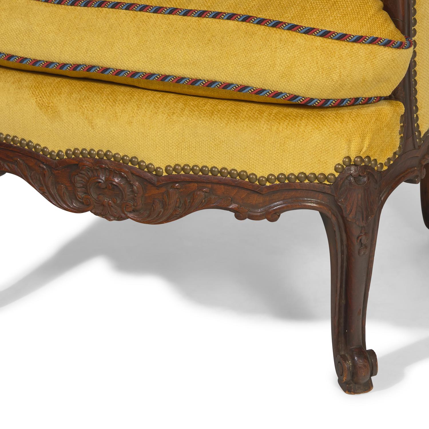 A Pair of Louis XV Style Carved Oak Bergerès