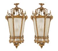A Pair of Louis XVI Style Gilt Bronze and Frosted Glass Hall Lanterns