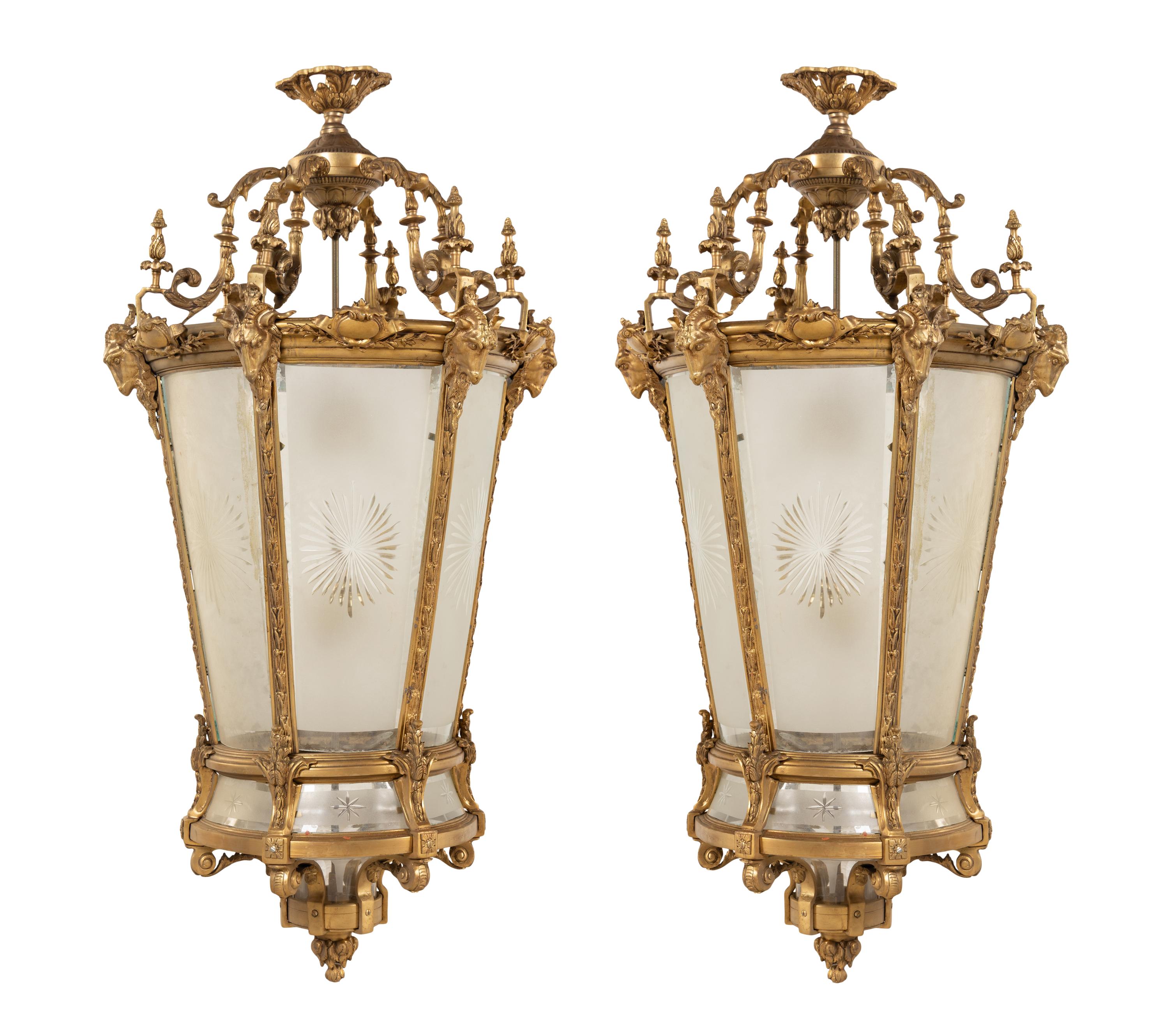 A Pair of Louis XVI Style Gilt Bronze and Frosted Glass Hall Lanterns