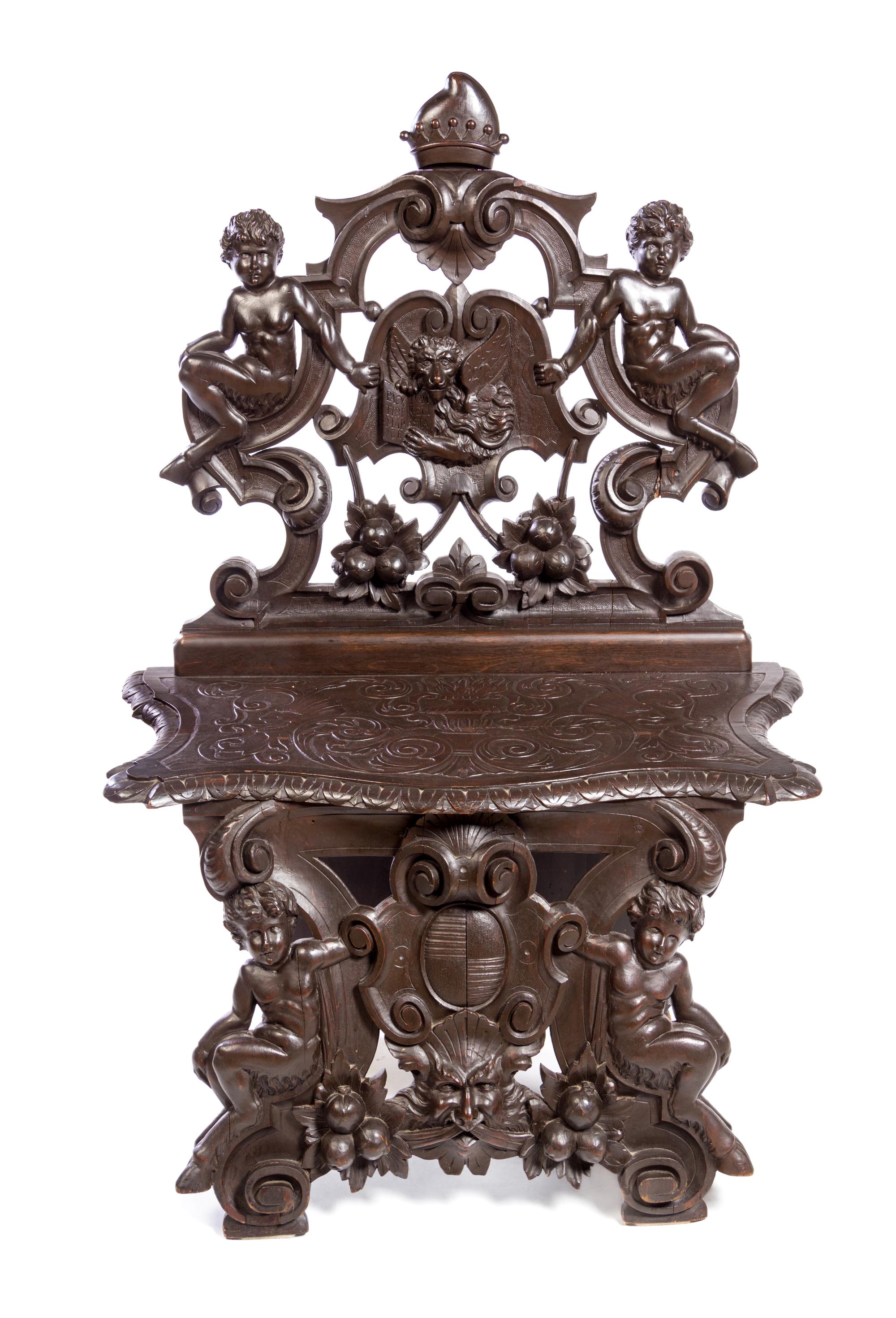 A Renaissance Style Carved Walnut Hall Chair Height 51 x width 34 1/2 inches. — 20TH CENTURY