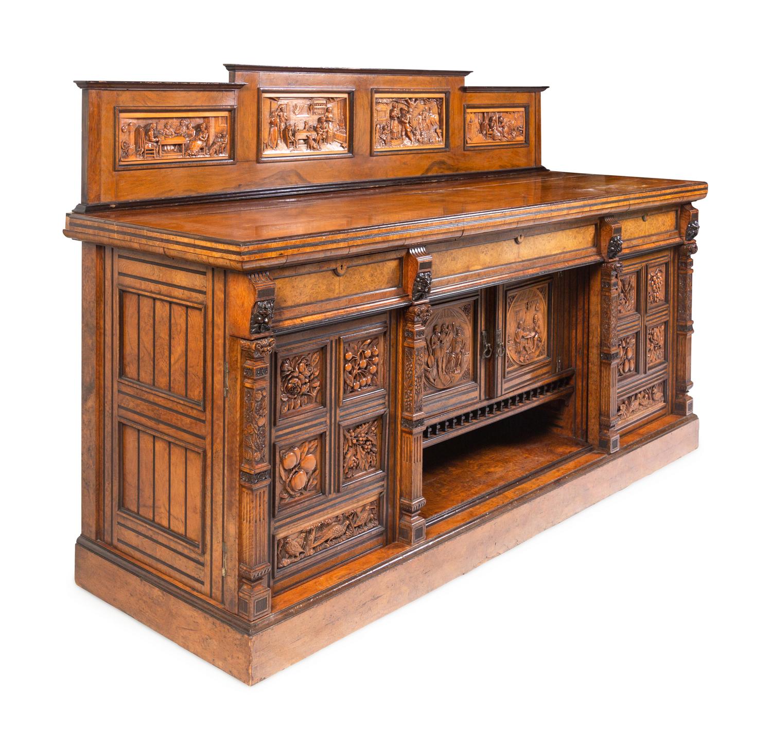 A Continental Carved Walnut and Burlwood Serving Cabinet