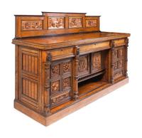 A Continental Carved Walnut and Burlwood Serving Cabinet