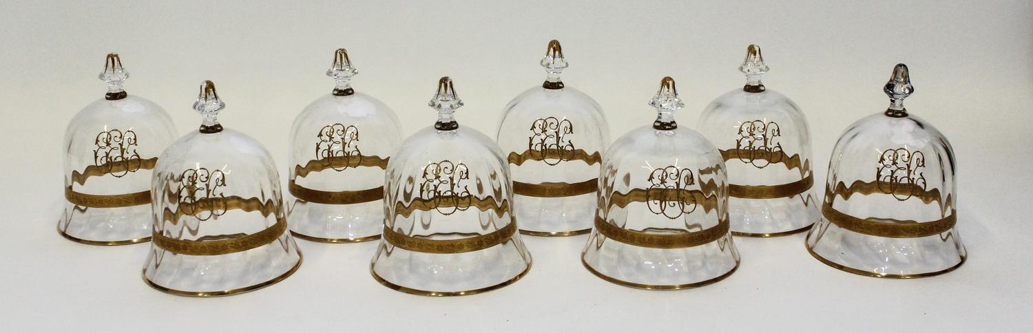 A Set of Eight Gilt Decorated Glass Cloches Height 5 inches.