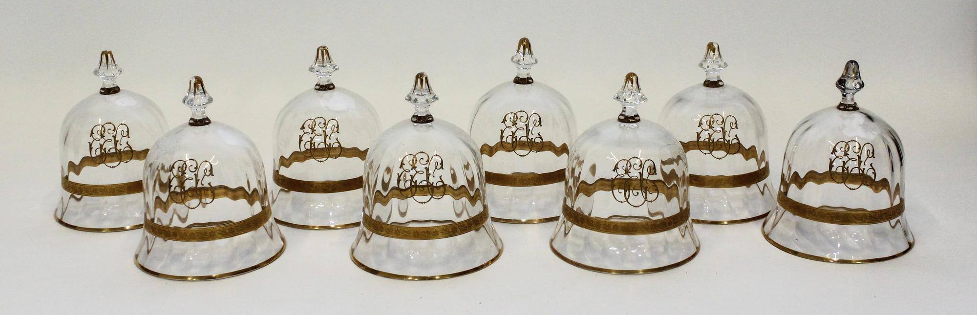 A Set of Eight Gilt Decorated Glass Cloches Height 5 inches.