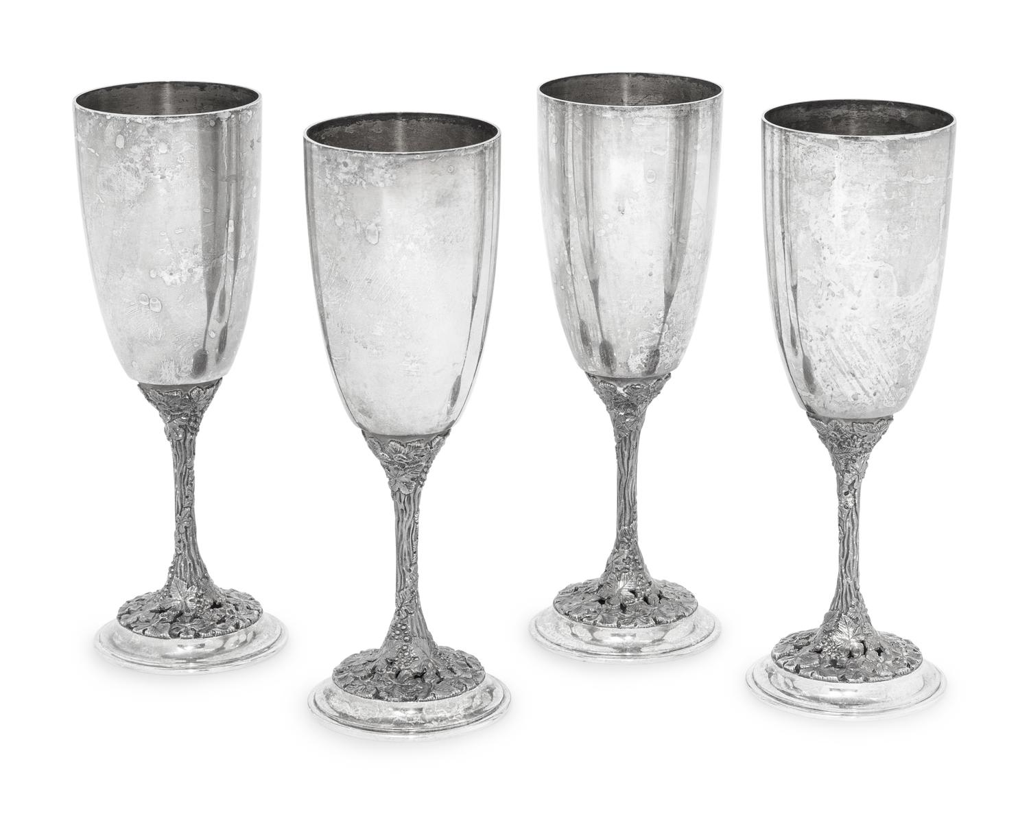 A Set of Four Asprey Silver Champagne Flutes and Tray