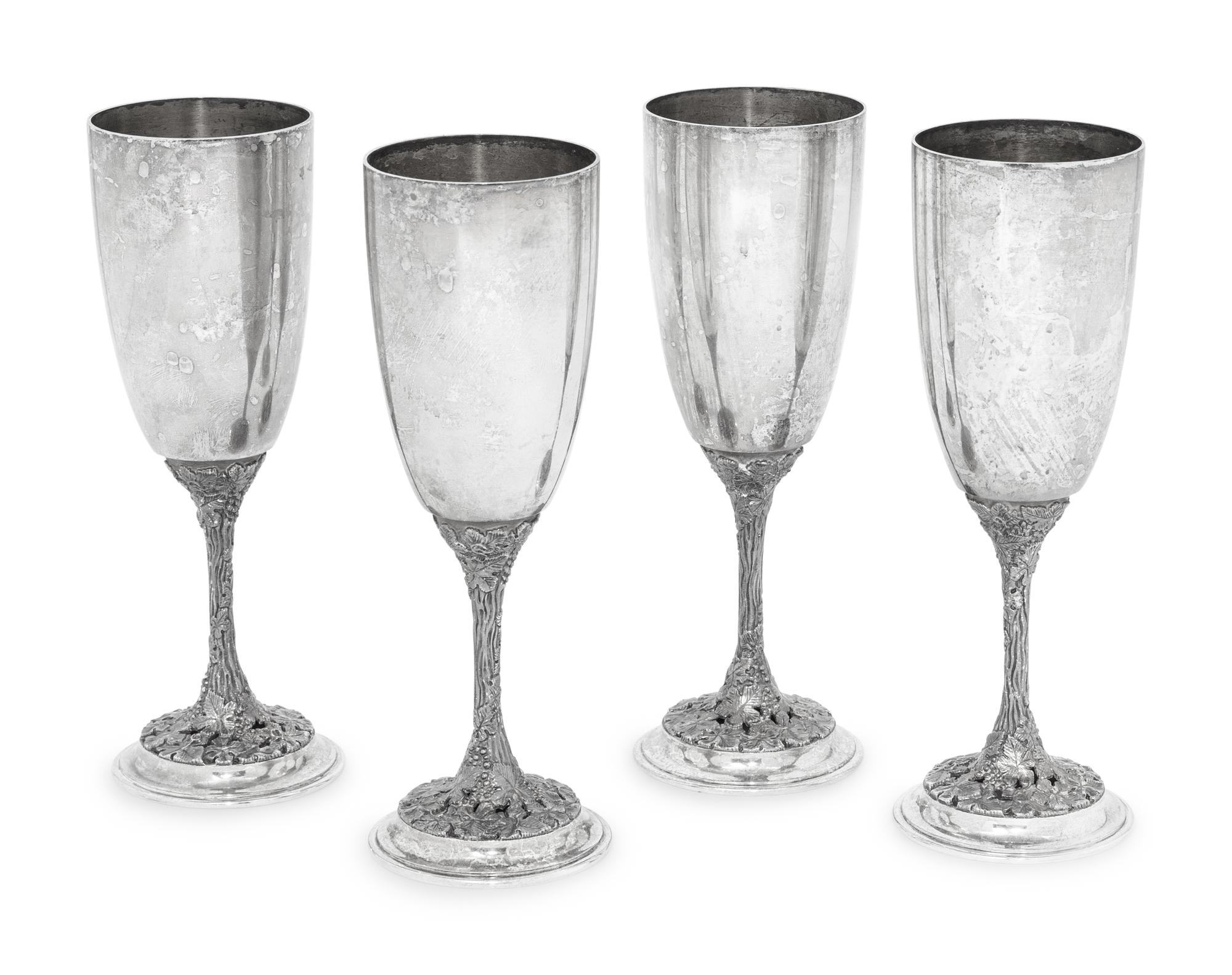 A Set of Four Asprey Silver Champagne Flutes and Tray
