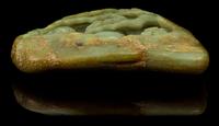 A Carved Celadon Jade Boulder Height 4 1/8 x width 5 1/2 inches.