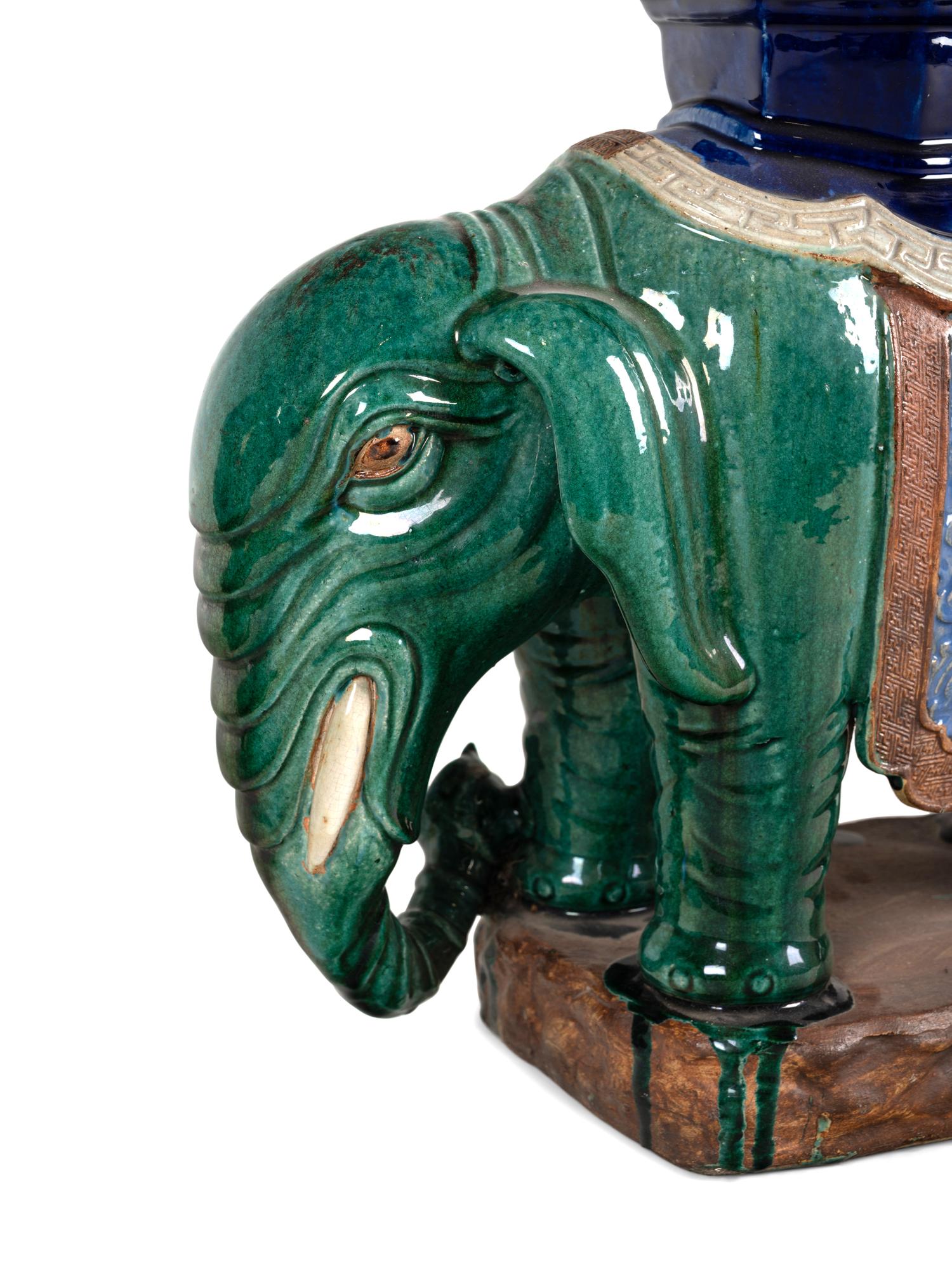 A Pair of Chinese Polychrome Glazed Porcelain Elephant Stands