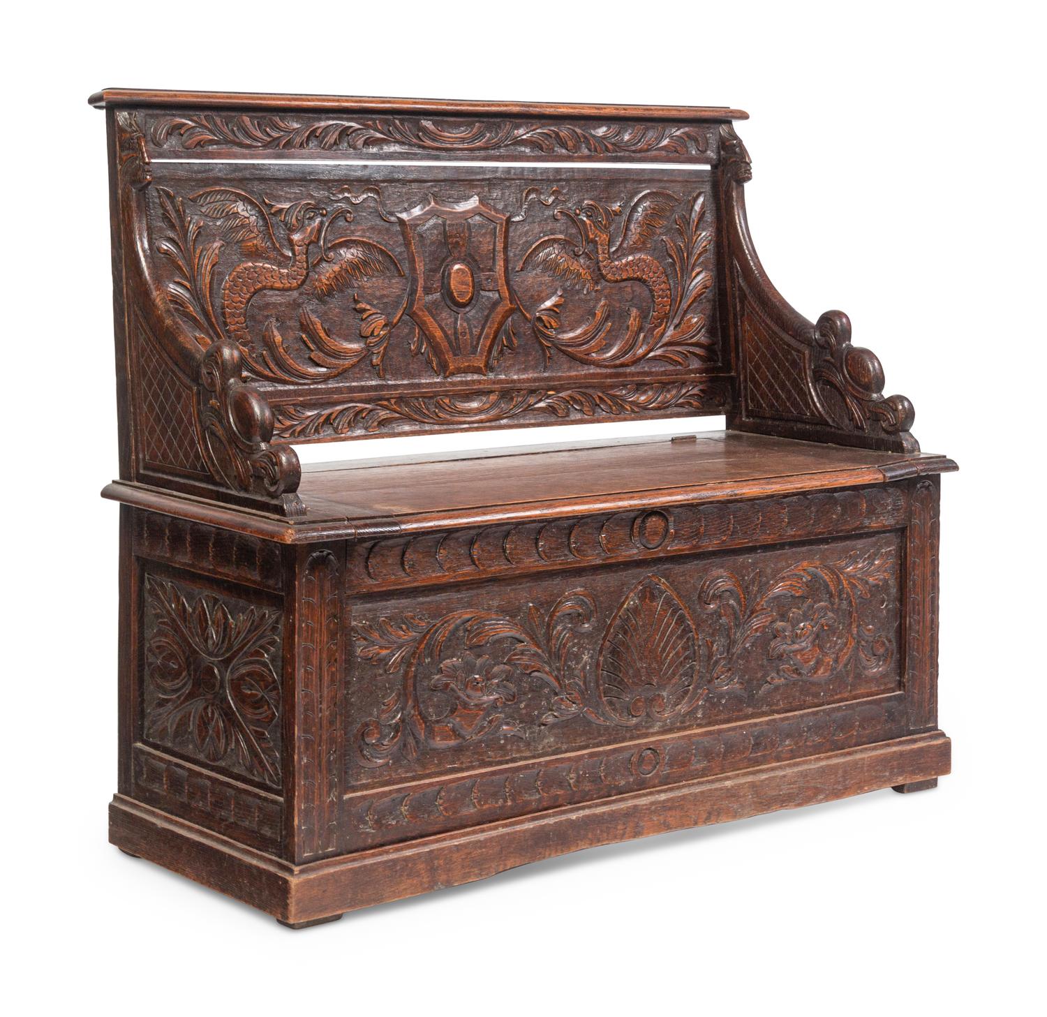 An Italian Renaissance Revival Carved Oak Settle