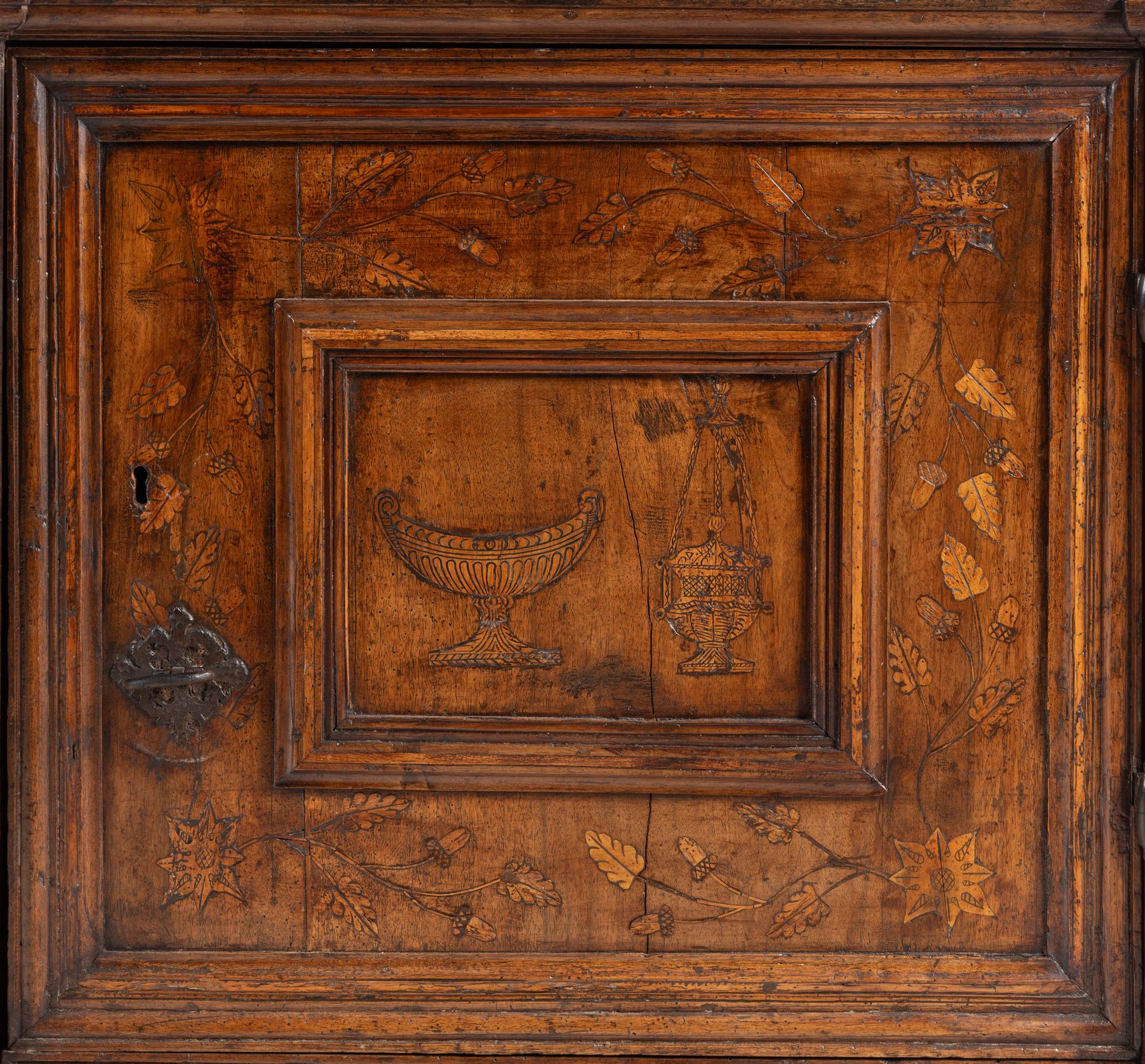 An Italian Baroque Walnut and Marquetry Cabinet