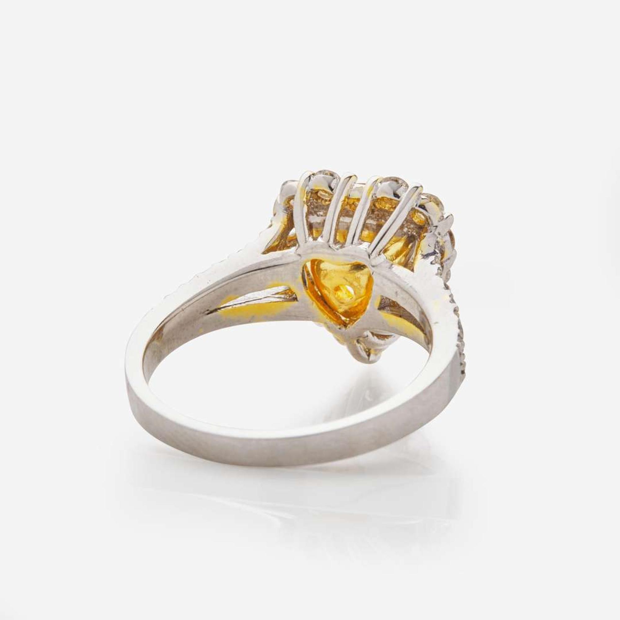 A Heart-Shape Colored Diamond, Diamond, and 18K Gold Ring 1.68 Carat Natural Fancy Yellow Heart-Shaped Diamond, GIA Certified