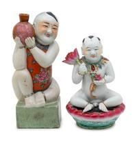 Two Chinese Famille Rose Porcelain Figures of Boys