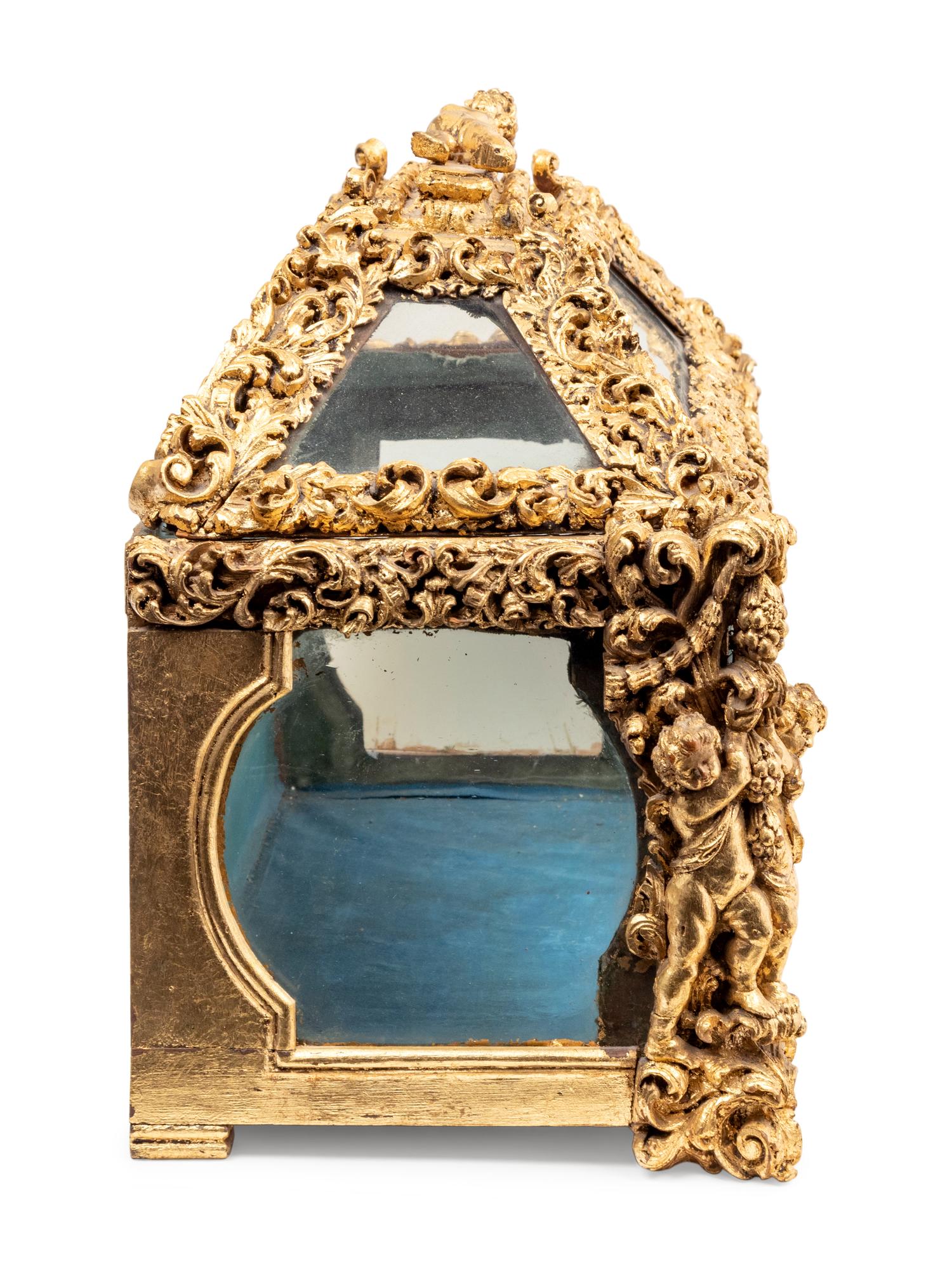 A Baroque Style Carved Giltwood Table Vitrine