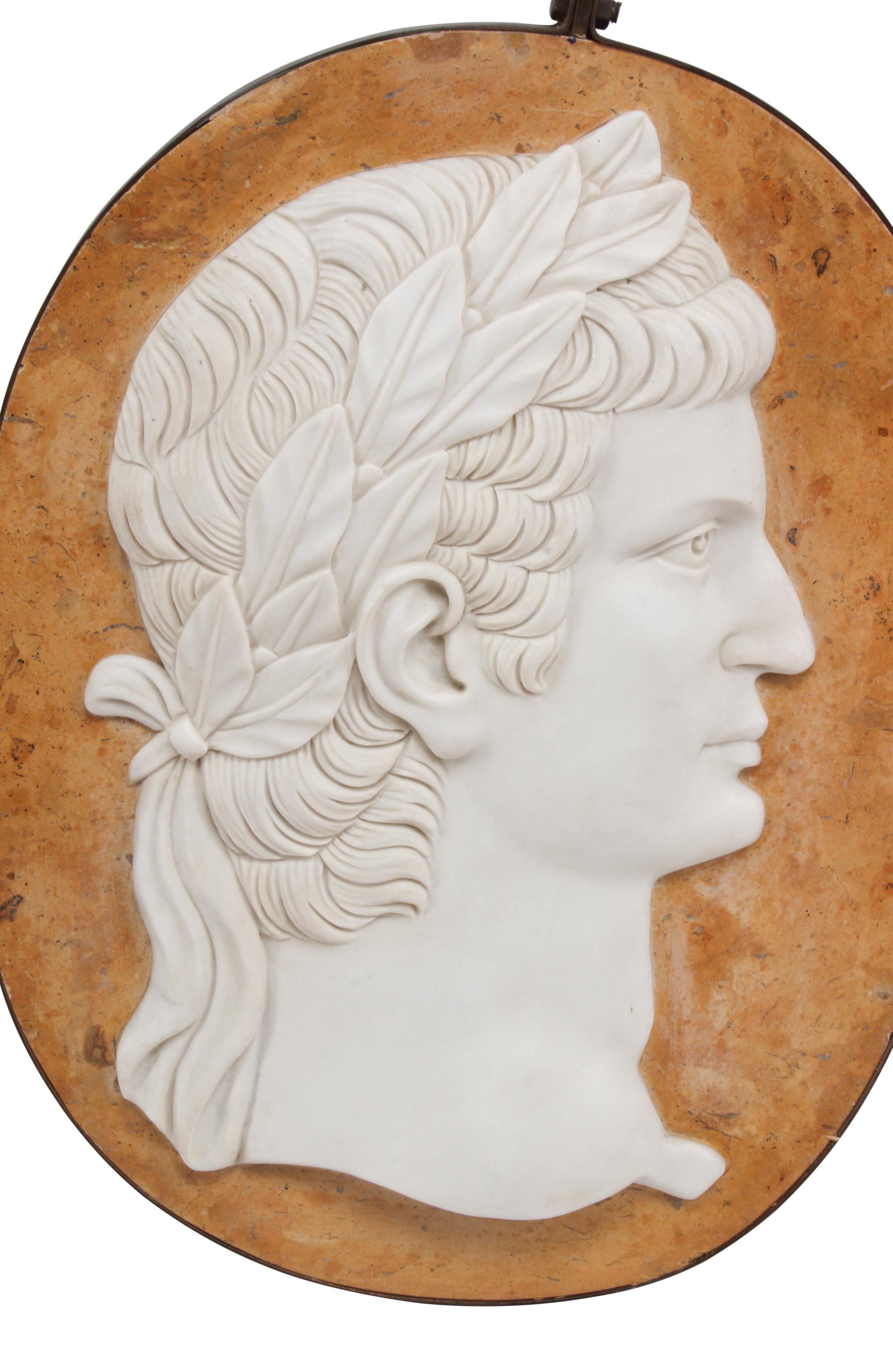A Set of Four Carved Marble and Iron Mounted Profile Plaques
