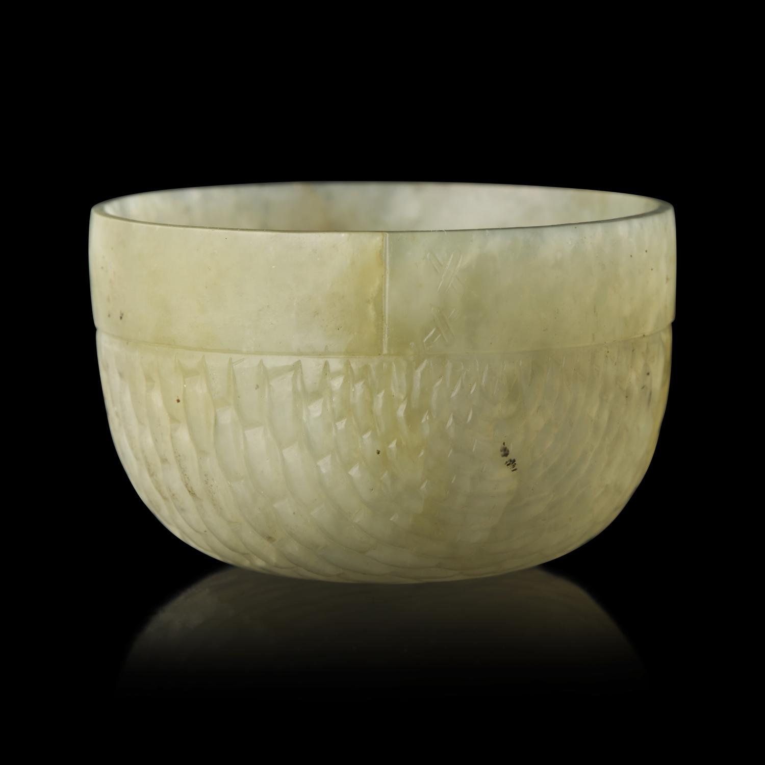 A Chinese Celadon Jade "Rice Measure" Cup, Late Ming-Early Qing — 明末清初 笸籮紋玉碗