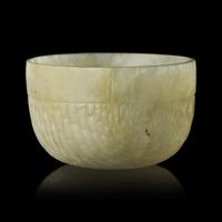 A Chinese Celadon Jade "Rice Measure" Cup, Late Ming-Early Qing — 明末清初 笸籮紋玉碗