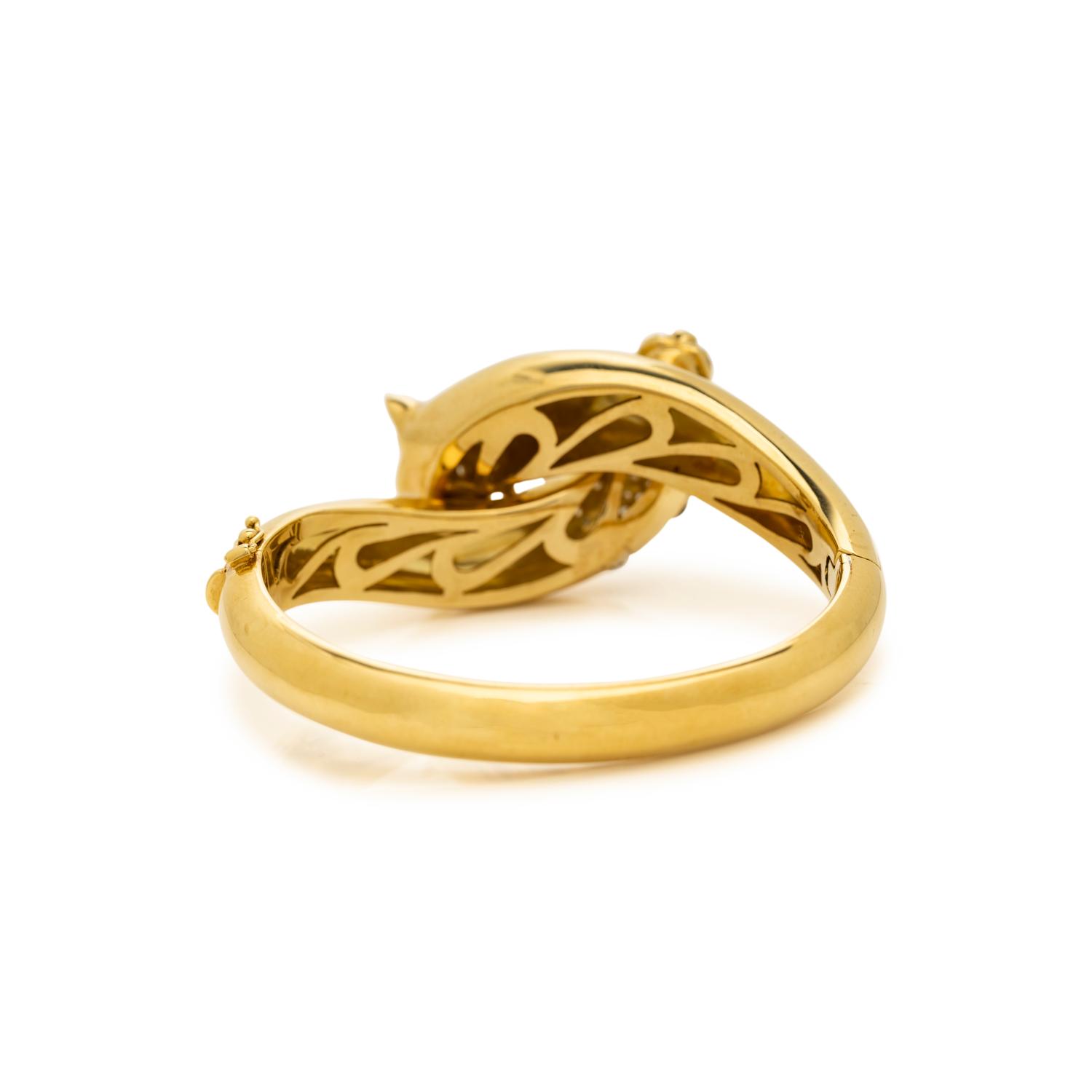 YELLOW GOLD, DIAMOND, EMERALD AND ENAMEL LEOPARD BANGLE BRACELET