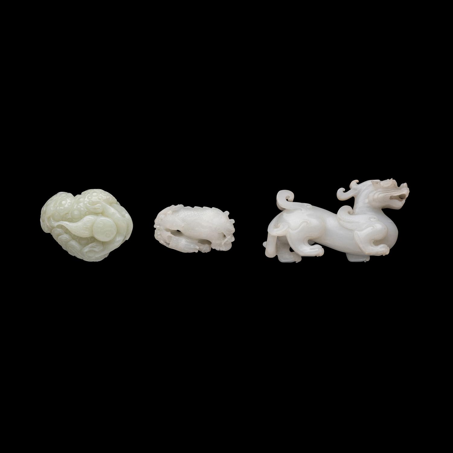 Three Chinese White Jade 'Mythical Beast' Jade Carvings, 20th Century 近代 白玉靈獸把件三枚