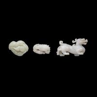 Three Chinese White Jade 'Mythical Beast' Jade Carvings, 20th Century 近代 白玉靈獸把件三枚