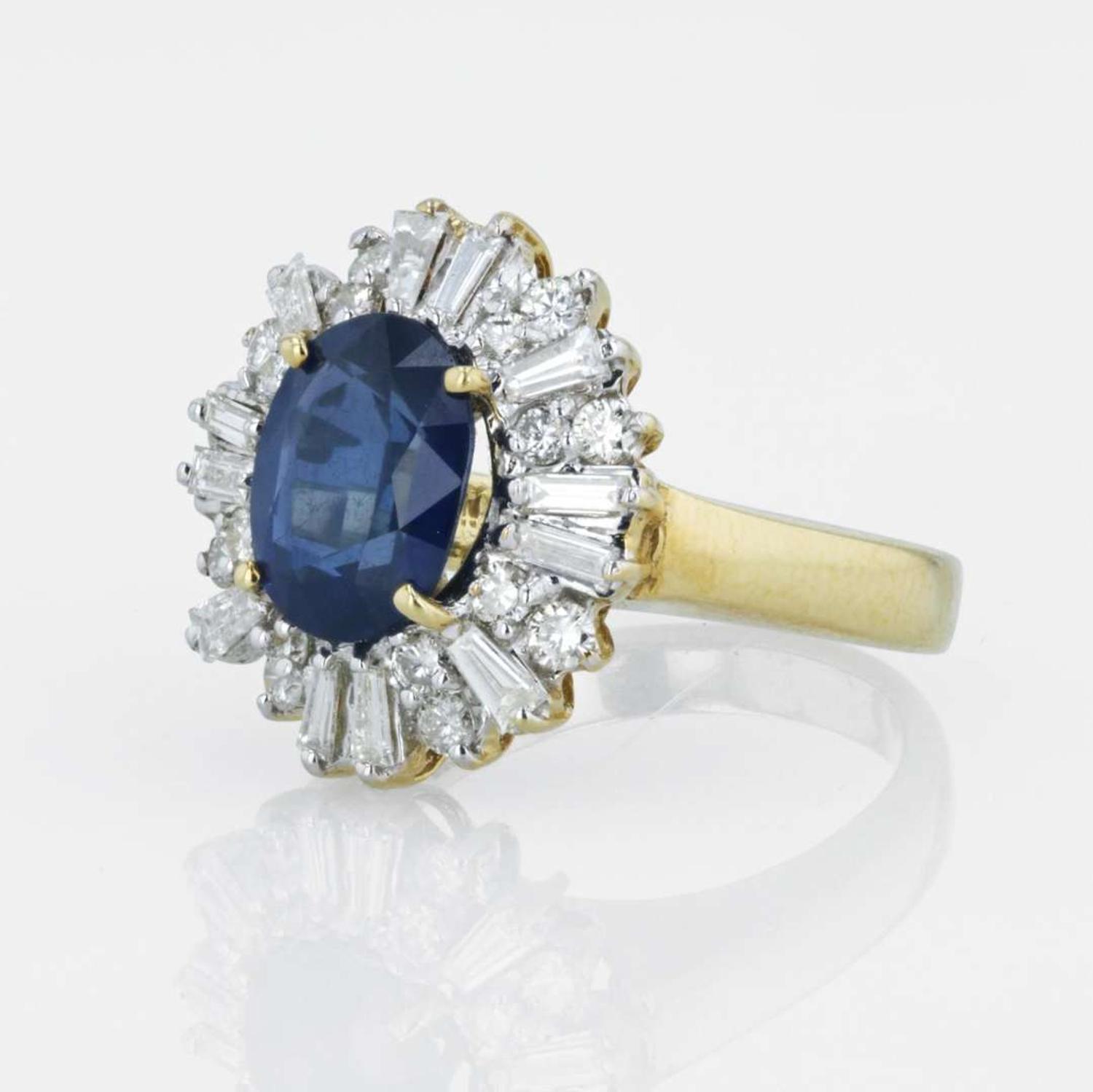 An 18K yellow gold, sapphire, and diamond ring