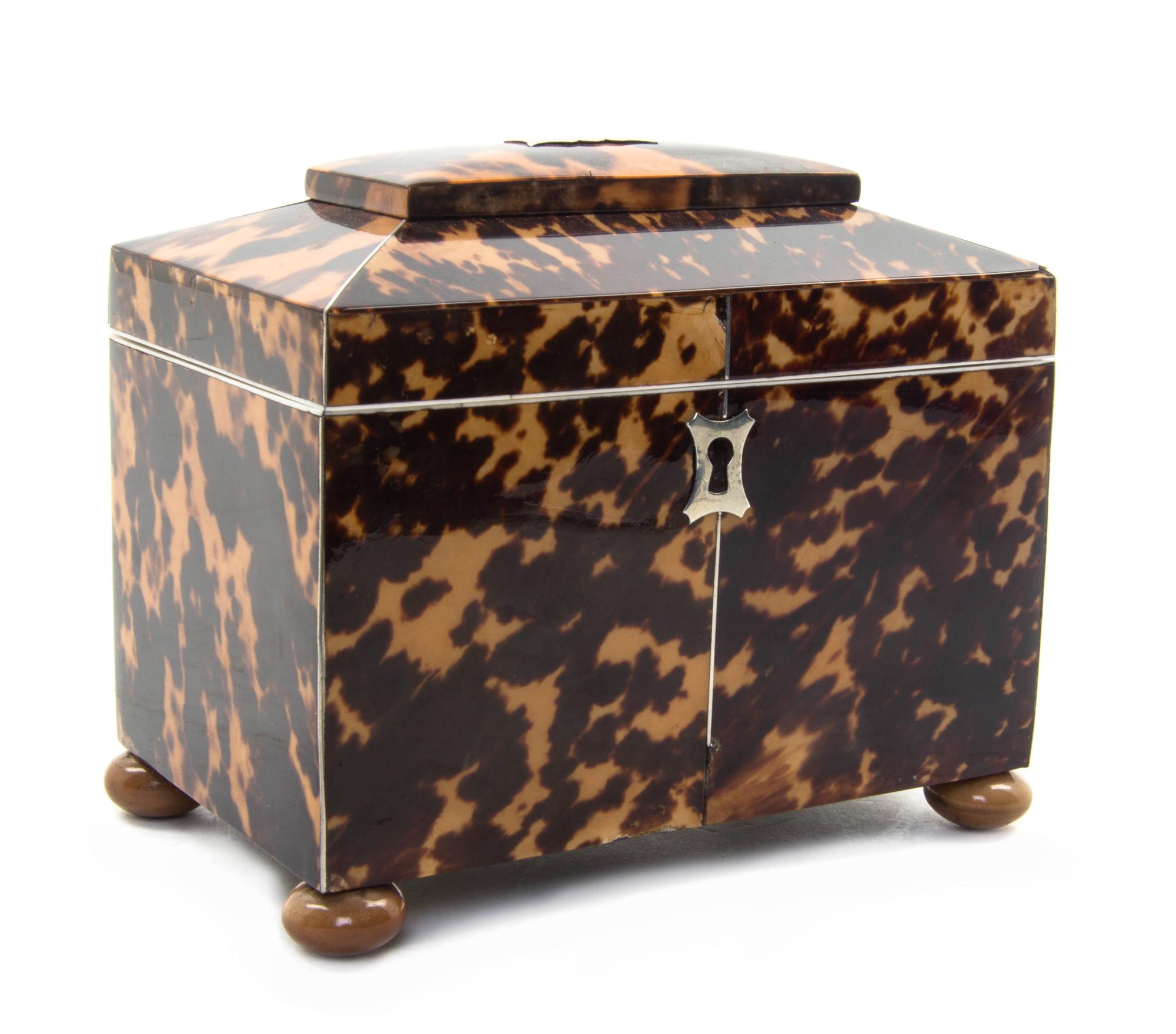 An English Tortoise Shell Tea Caddy, Height 4 1/4 x width 5 x depth 3 inches.