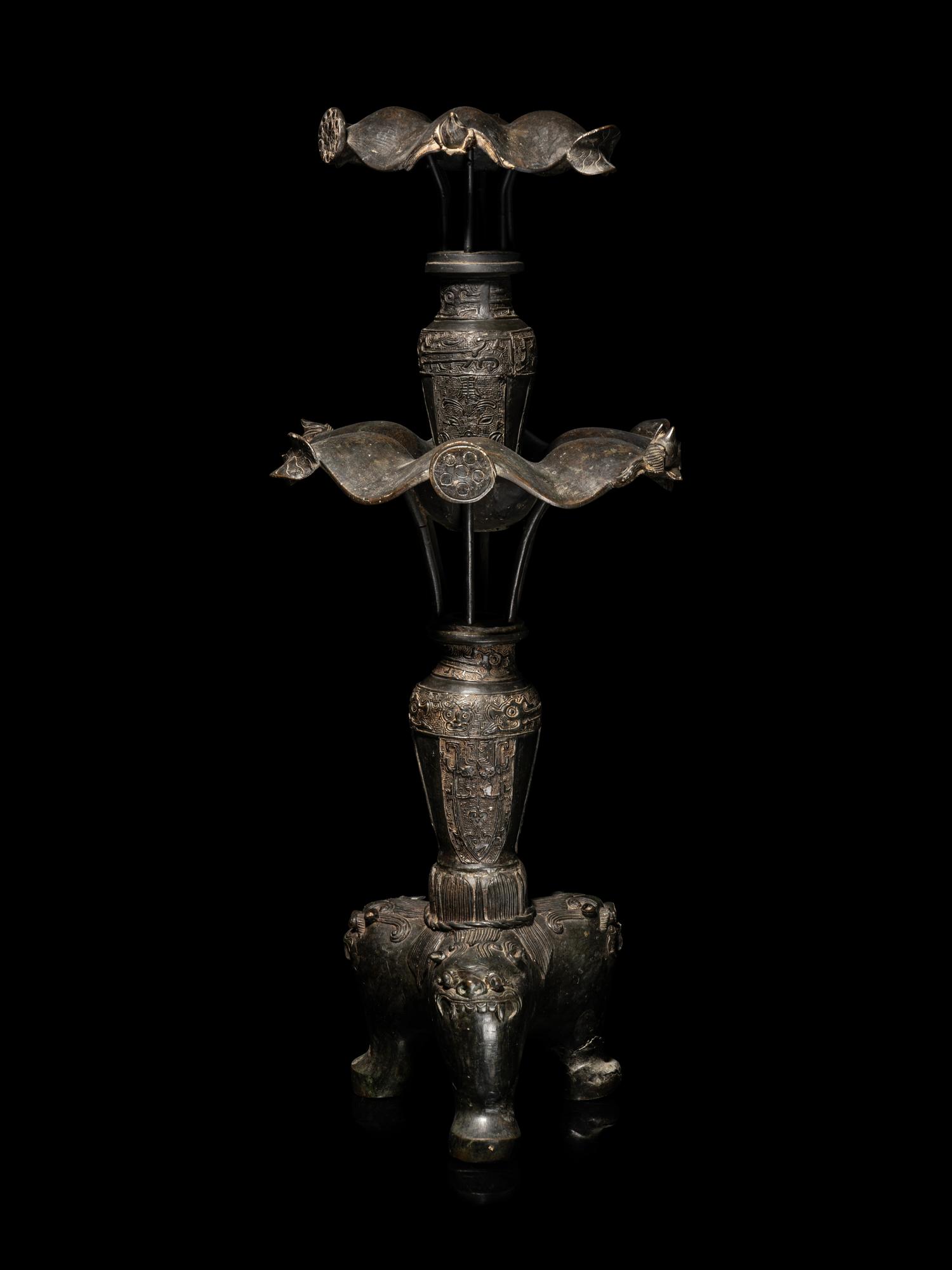A Large Pair of Bronze Candle Holders