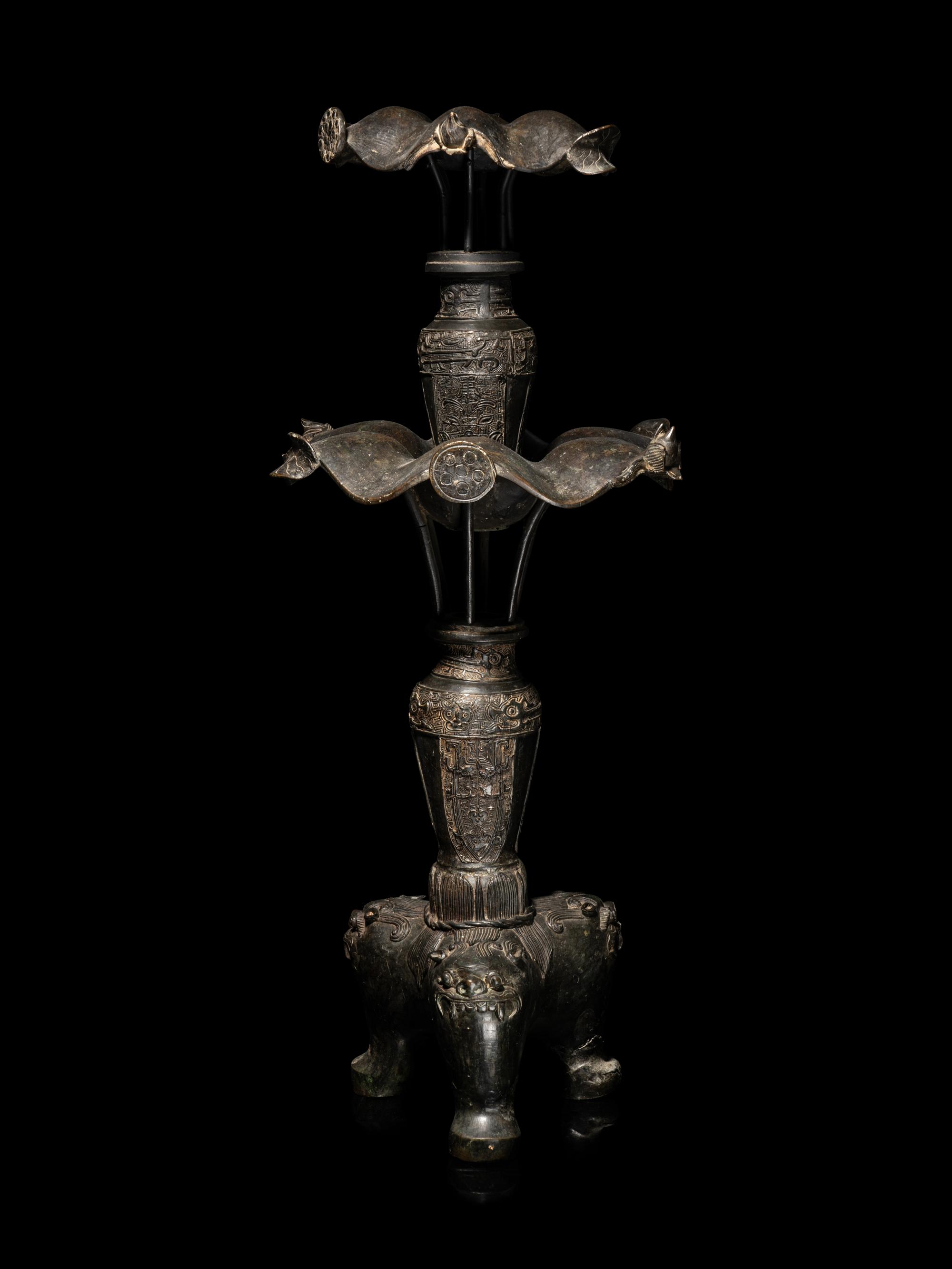 A Large Pair of Bronze Candle Holders