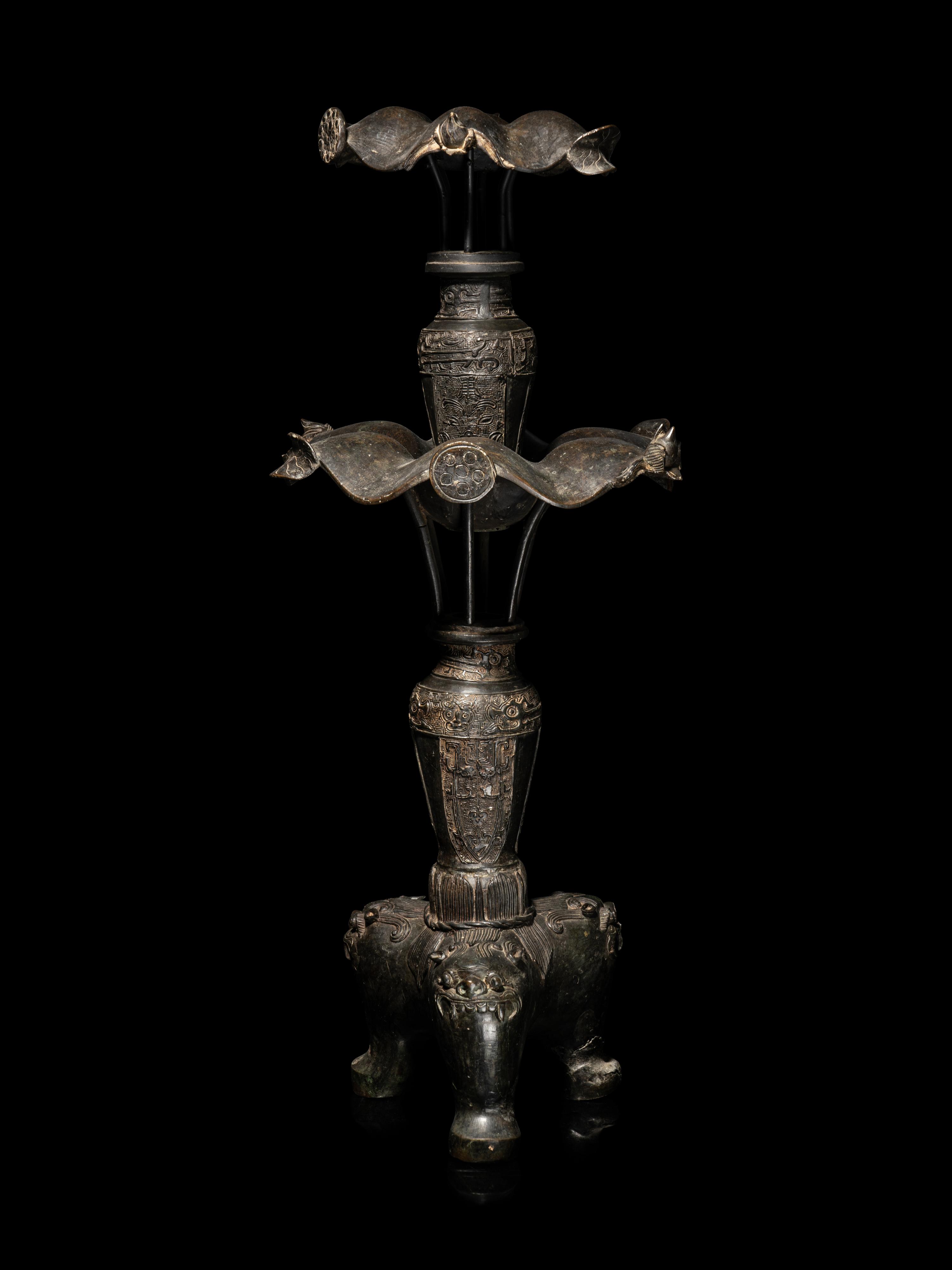 A Large Pair of Bronze Candle Holders